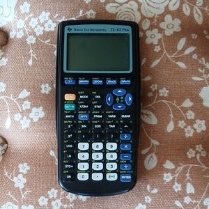 Texas Instruments TI-83 Plus Graphing Calculator - Black with White & Blue Keys